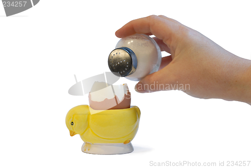 Image of sprinkling salt on a boiled egg