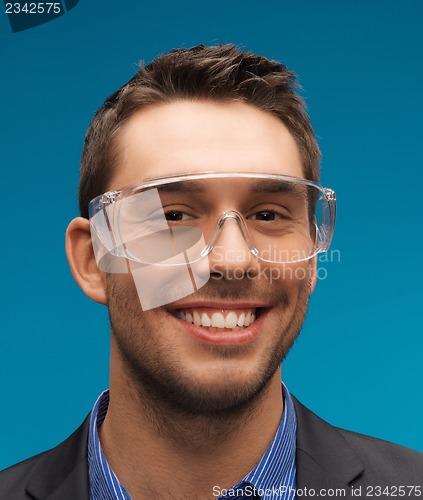 Image of businessman in protective glasses