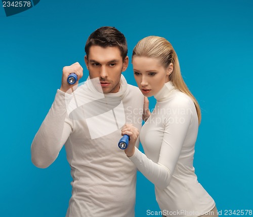 Image of man and woman with pocket flashlights