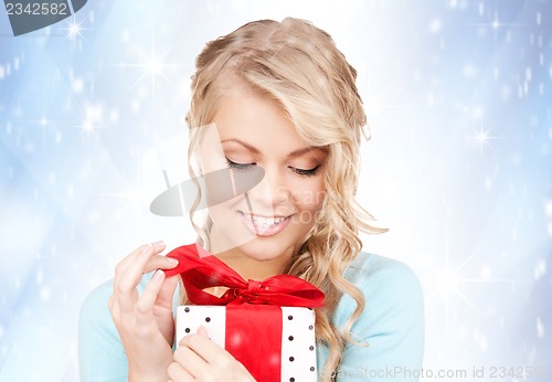 Image of happy woman with gift box
