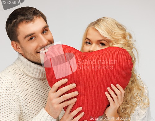 Image of family couple in a sweaters with heart