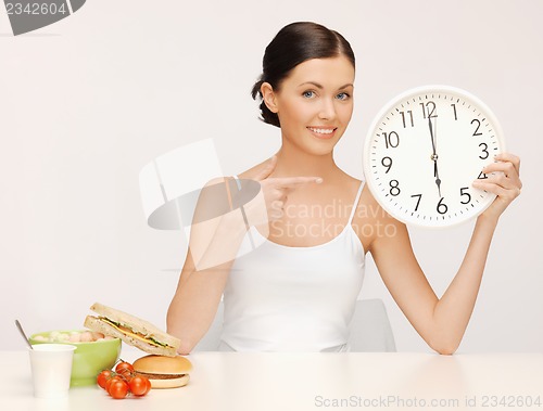 Image of woman with big clock