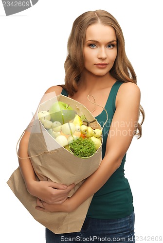 Image of woman with shopping bag full of fruits