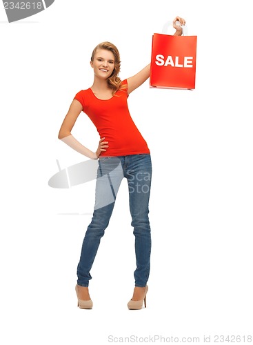 Image of teenage girl in red t-shirt with shopping bag