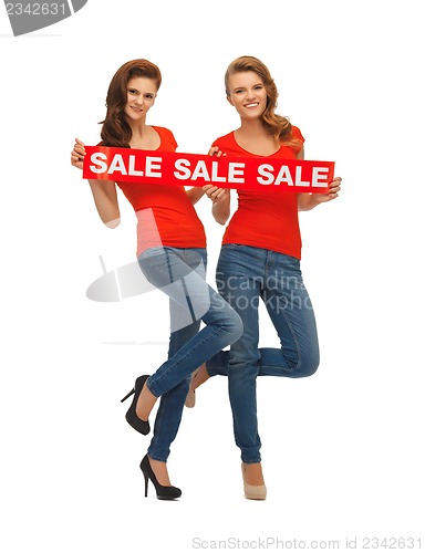 Image of two teenage girls with sale sign