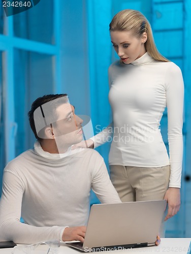 Image of man and woman in laboratory