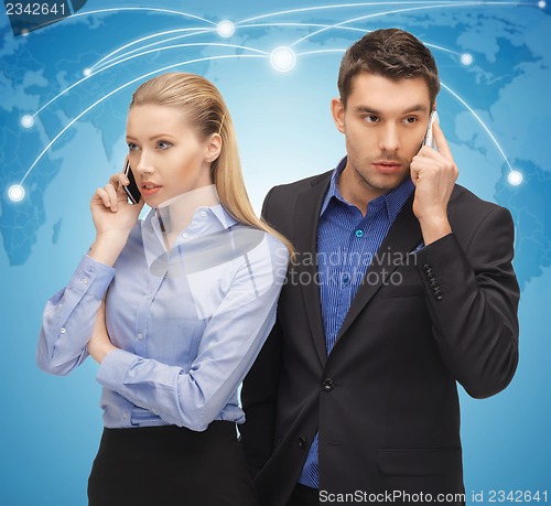 Image of man and woman with cell phones