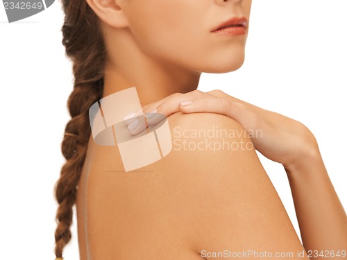 Image of woman's hand and shoulder