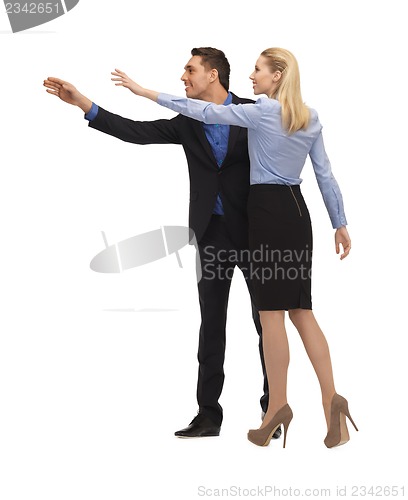 Image of man and woman making a greeting gesture