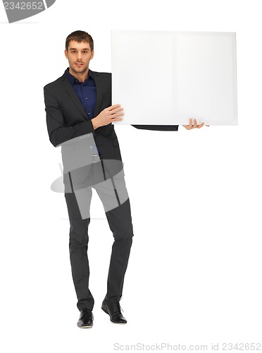 Image of handsome man in suit with a blank board