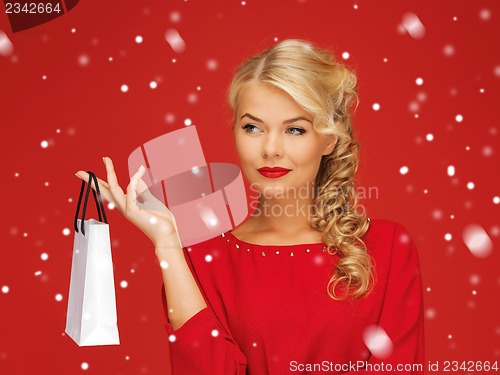 Image of lovely woman in red dress with shopping bag