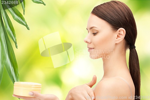 Image of beautiful woman with moisturizing creme