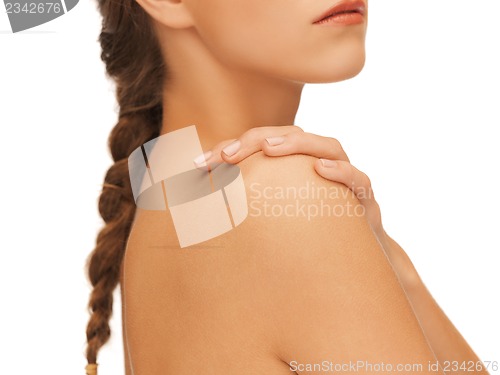 Image of woman's hand and shoulder