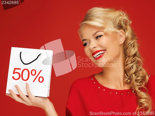 Image of lovely woman in red dress with shopping bag