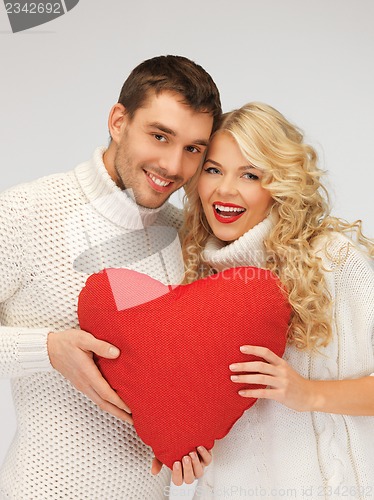 Image of family couple in a sweaters with heart