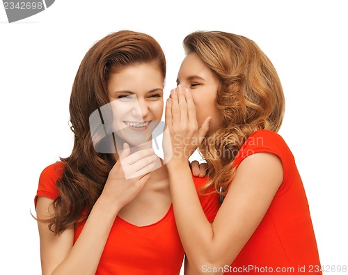 Image of two talking teenage girls in red t-shirts