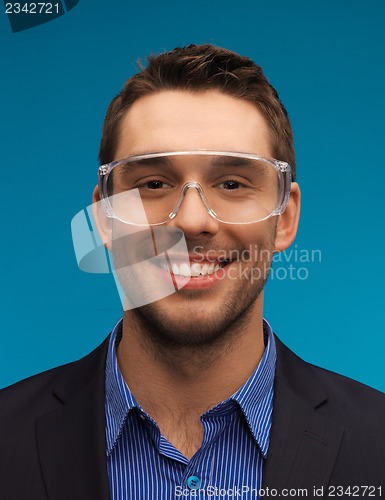 Image of businessman in protective glasses