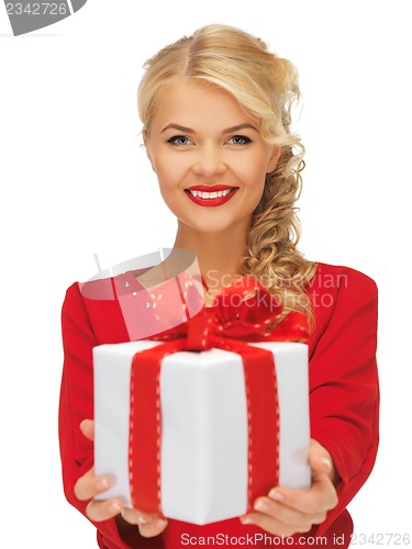 Image of lovely woman in red dress with present