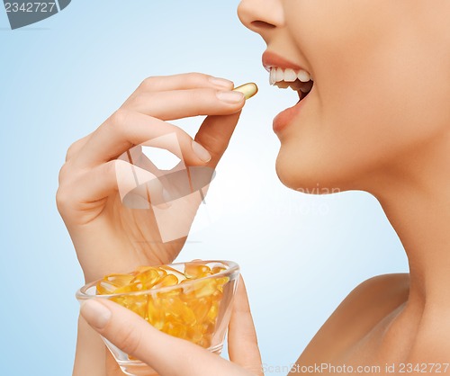 Image of woman with vitamins