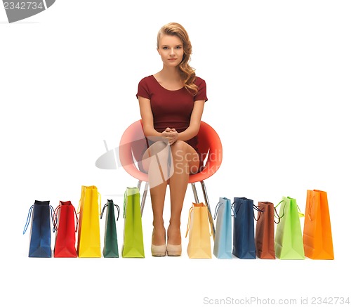 Image of teenage girl in red dress with shopping bags