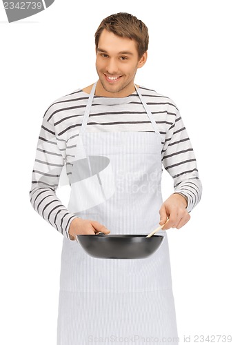 Image of handsome man with pan and spoon