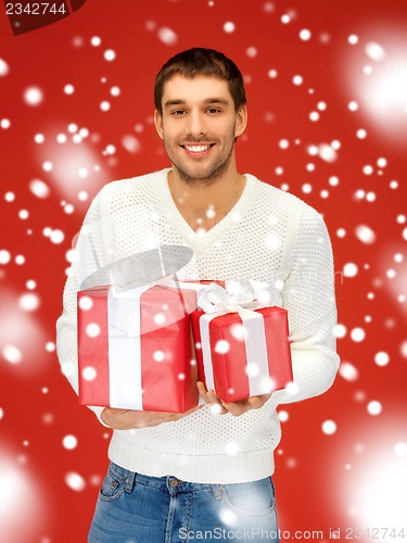 Image of man holding many gift boxes