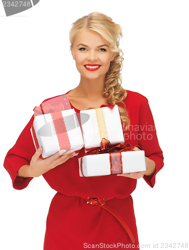 Image of lovely woman in red dress with gift boxes