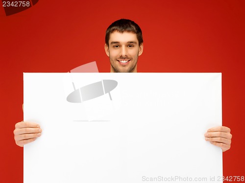 Image of handsome man with big blank board