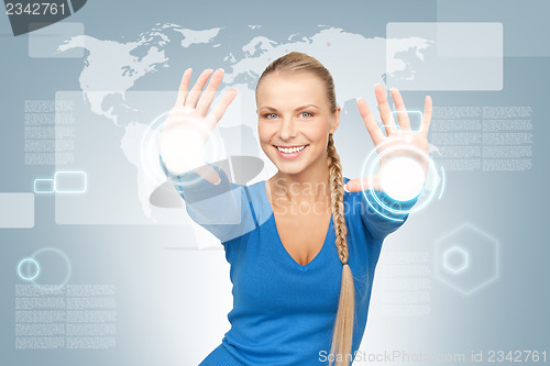 Image of businesswoman working with touch screen