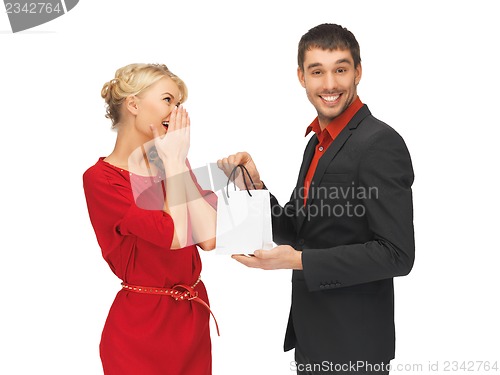 Image of man and woman with present