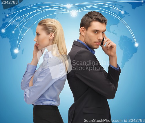 Image of man and woman with cell phones