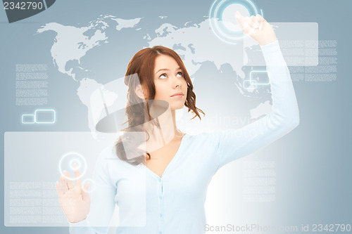 Image of businesswoman working with touch screen