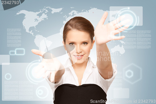 Image of businesswoman working with touch screen