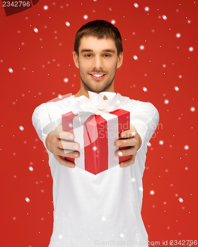 Image of handsome man with a gift