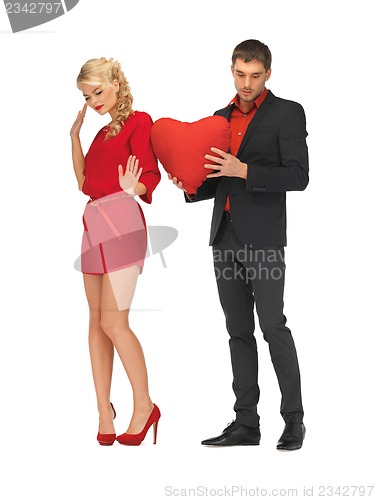 Image of beautiful couple holding big heart