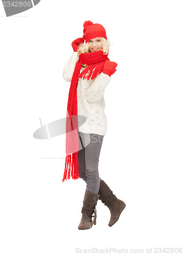 Image of beautiful woman in hat, muffler and mittens
