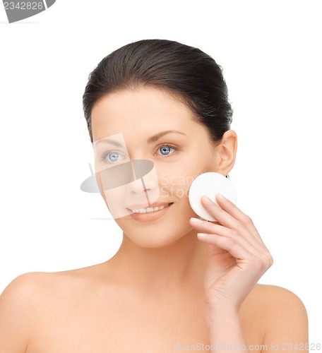 Image of beautiful woman with cotton pad