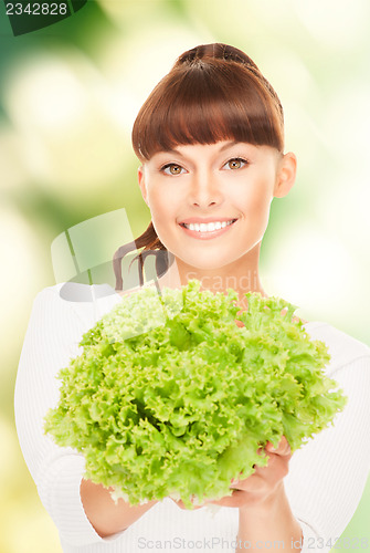 Image of beautiful housewife with lettuce