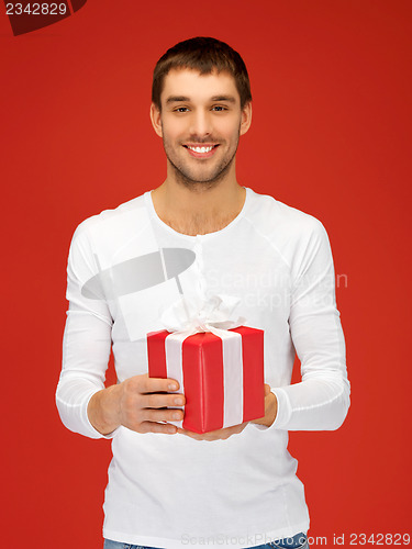 Image of handsome man with a gift