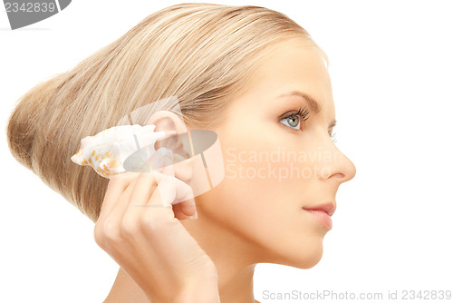 Image of beautiful woman with seashell