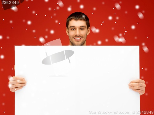 Image of handsome man with big blank board