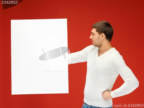 Image of handsome man with big blank board