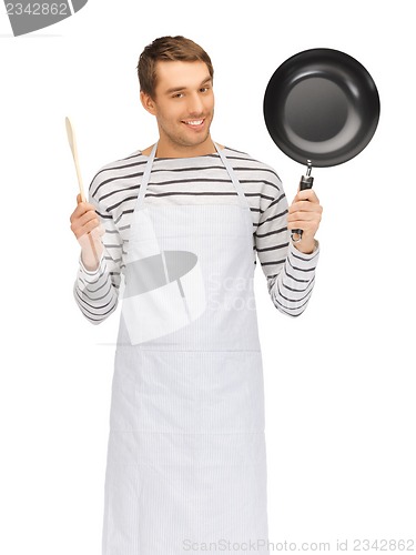 Image of handsome man with pan and spoon