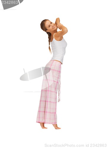 Image of woman in pajamas doing morning exercise