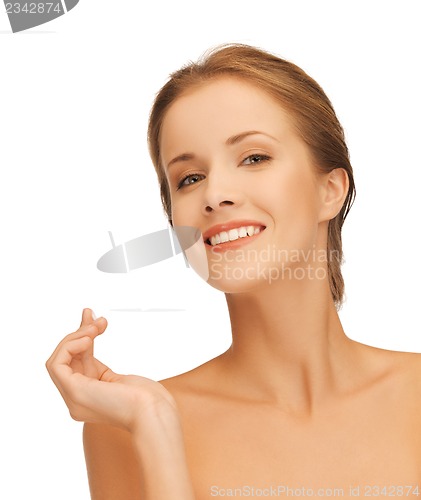 Image of beautiful woman with moisturizing creme drop
