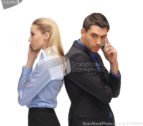 Image of man and woman with cell phones
