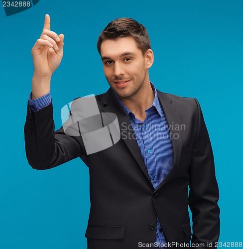 Image of man in suit with his finger up