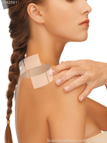 Image of woman's hand and shoulder