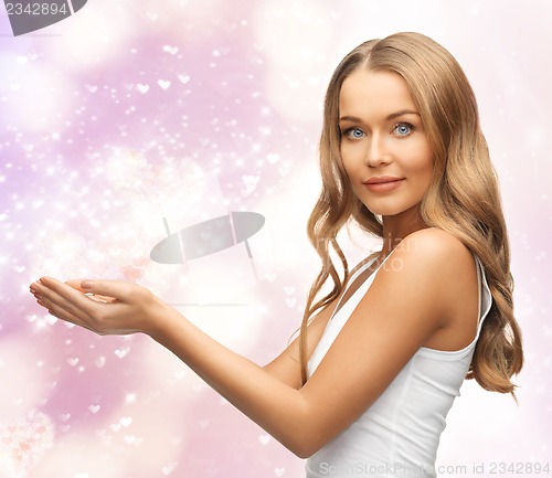 Image of woman holding something on the palms