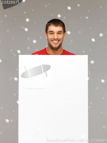 Image of handsome man with big blank board